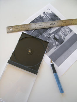 1. Remove all paper inserts from the jewel cases. Cut black and white photos to fit: 4-3/4 inches wide by 4-7/8 inches tall. Insert them into the jewel cases with the hinge at the bottom.